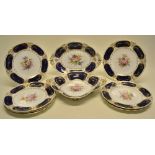 A late Victorian Royal Crown Derby dessert service, painted pink roses and other flowers, Royal blue