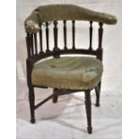 An unusual George III mahogany corner armchair, the padded arms on tapering reeded columns, (one