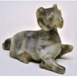 A Chinese mutton fat jade recumbent model of a ram. 3.25in (8.25cm). * Ex Toke family, Godersden