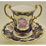 A late Victorian Royal Crown Derby porcelain cup and stand, painted a pink rose and attached flowers