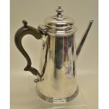 An early George II large silver coffee pot, the tapering body engraved a winged stags head crest,