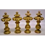 A two pairs of carved gilt wood finials, for a late seventeenth century style cabinet, of baluster