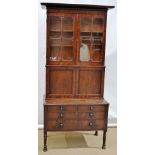 An early nineteenth century North American mahogany secretary bookcase, the top with a cavetto