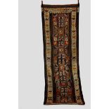 Karabakh medallion long rug, south west Caucasus, early 20th century, 9ft. 11in. x 3ft. 6in. 3.