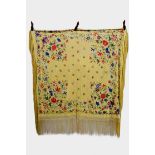 Chinese yellow silk reversible shawl, exquisitely embroidered in coloured silks with flowers and