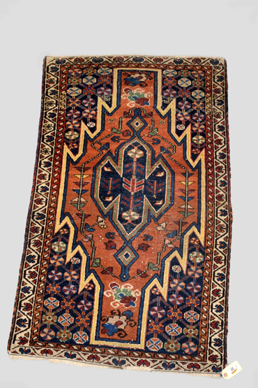 Mazlaghan rug, north west Persia, circa 1930s-40s, 4ft. x 2ft. 4in. 1.22m. x 0.71m. Overall wear;