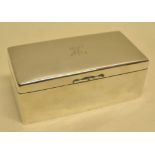 An Edwardian silver rectangular cigarette box, the hinged lid engraved initials, cedar lined