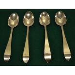 Four Irish silver late eighteenth century tablespoons, with taper ends, one engraved with a crest,