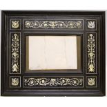 A late nineteenth century Italian picture frame, ebonized with ebony mouldings, inlaid ivory