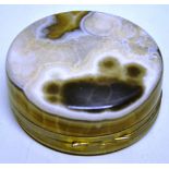 A large agate circular box, with nickel mounts to the hinged lid 4in (10cm) diameter.