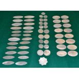 A collection of nineteenth century Chinese mother of pearl counters; 16 oval, 24 elliptical, 17