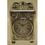A George V silver cased boudoir timepiece, with a French lever movement, the circular white enamel