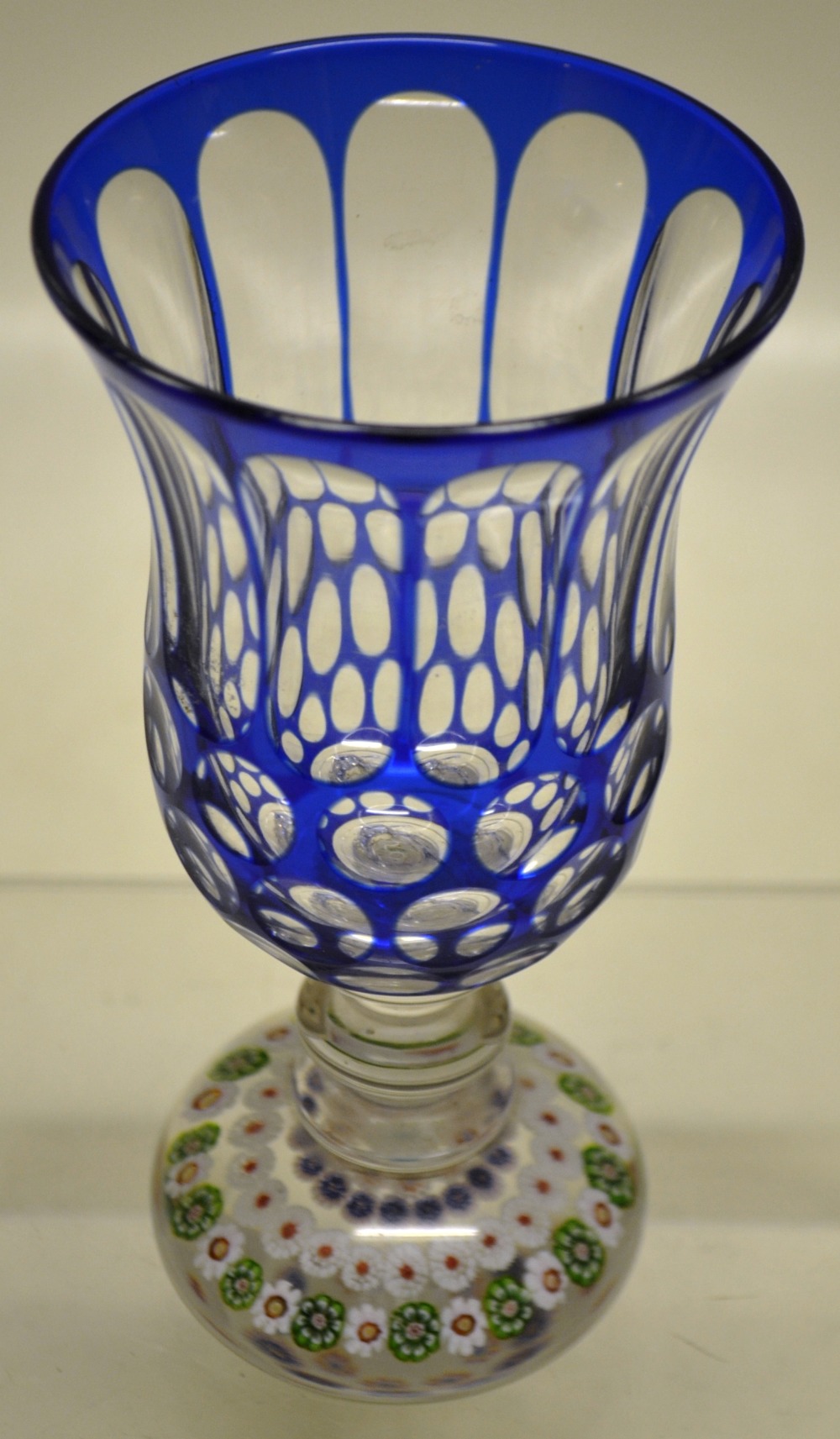 A French mid nineteenth century cut glass goblet, with blue overlay on a glass paperweight base with