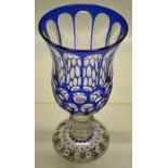 A French mid nineteenth century cut glass goblet, with blue overlay on a glass paperweight base with