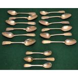 Eleven early nineteenth century Irish silver fiddle pattern teaspoons with rat tail bowls, some