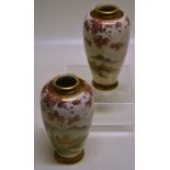 A pair of Japanese satsuma ovoid vases, decorated pagodas in a mountainous landscape, with gilt,