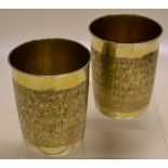A pair of George III silver gilt beakers, with matt chased sides, 3.6in (9.5cm). Maker William