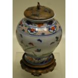 A Chinese Wuci porcelain baluster vase, decorated in underglaze blue and overglaze famille verte