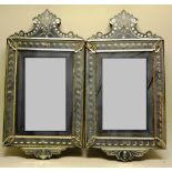 A pair of late nineteenth century Italian mirrors, the rectangular bevelled plates on cut roundel