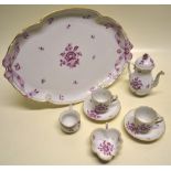 A Herend porcelain cabaret set, with puce floral decoration, comprising; a coffee pot, cream jug,