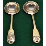 A pair of Regency silver sauce ladles, fiddle and shell pattern, crested. Maker William Chawner