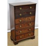A small George III mahogany secretaire, the front with a fall flap with two dummy drawers, a