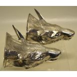 A pair of George III silver fox head mask stirrup cups, gilded inside, having pricked up ears,