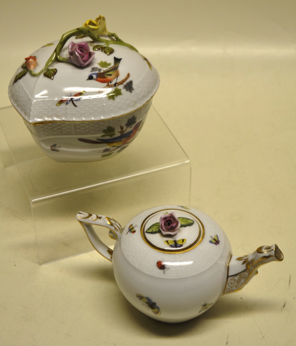 A Herend porcelain teapot, decorated birds and insects, gilt decorated spout and bracket handle, the