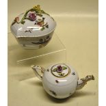 A Herend porcelain teapot, decorated birds and insects, gilt decorated spout and bracket handle, the