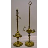Two nineteenth century brass library oil lamps, one with two lights, a dog mask handle, the stem