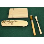 A nineteenth century Ivory card case, a late Victorian cigarette holder, silver mounted to the amber