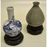 A Chinese grey celadon small vase, with a narrow neck. 3.75in (9.5cm) and a Chinese blue and white
