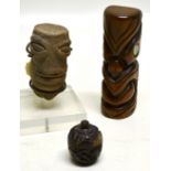 An African carved pottery head 3.5in (9cm) on stand, a hardwood Maori carved head with mother of