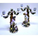 A pair of late nineteenth century Sitzendorf porcelain twinlight candleabra, the branches with
