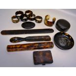 Tortoiseshell and faux tortoiseshell items; a paper knife, 11in (28cm) a shoe horn with silver pique