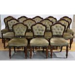 A set of twelve Victorian Irish mahogany side chairs, the show frame button upholstered backs with