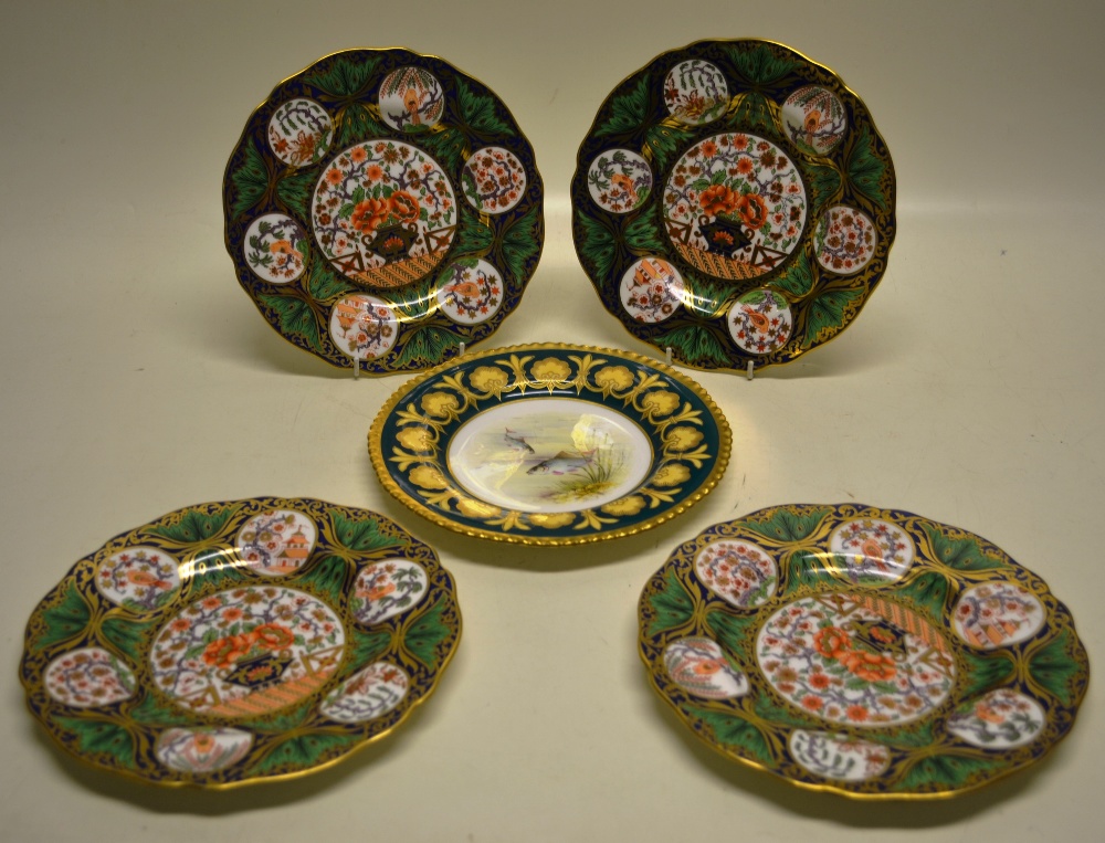 A set of four Edwardian Wedgwood bone china plates, decorated in coloured enamels, Oriental style