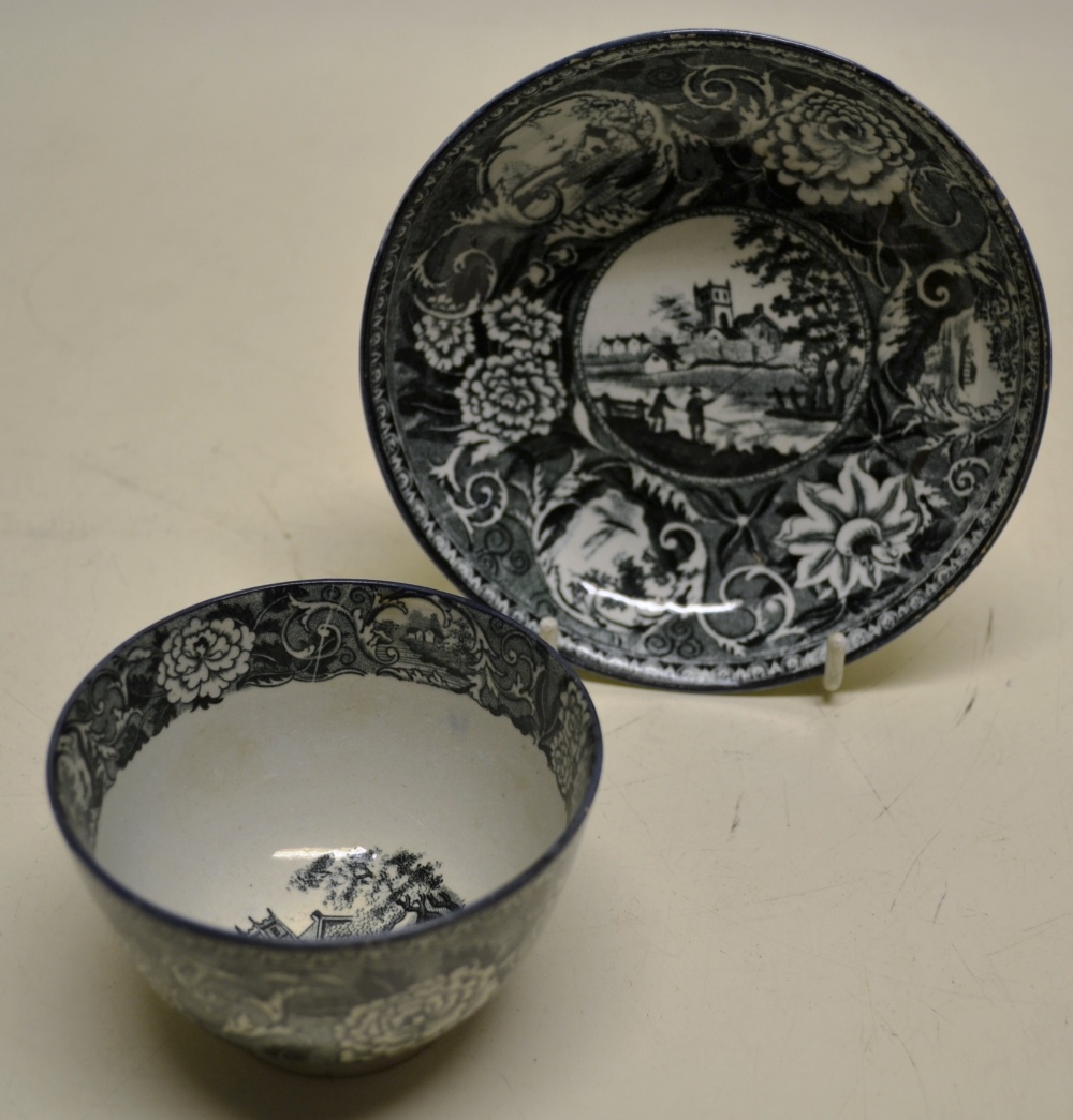 An early nineteenth century prattware tea bowl and saucer, with green transfer decoration of rural