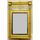 A Regency gilt frame small pier mirror, the cornice above a verre eglomise panel, gothic cluster