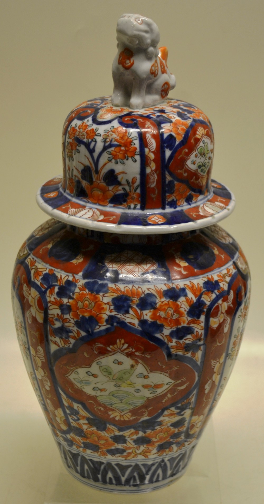 A late nineteenth century Japanese Imari porcelain ribbed vase and cover, decorated in underglaze