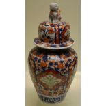 A late nineteenth century Japanese Imari porcelain ribbed vase and cover, decorated in underglaze