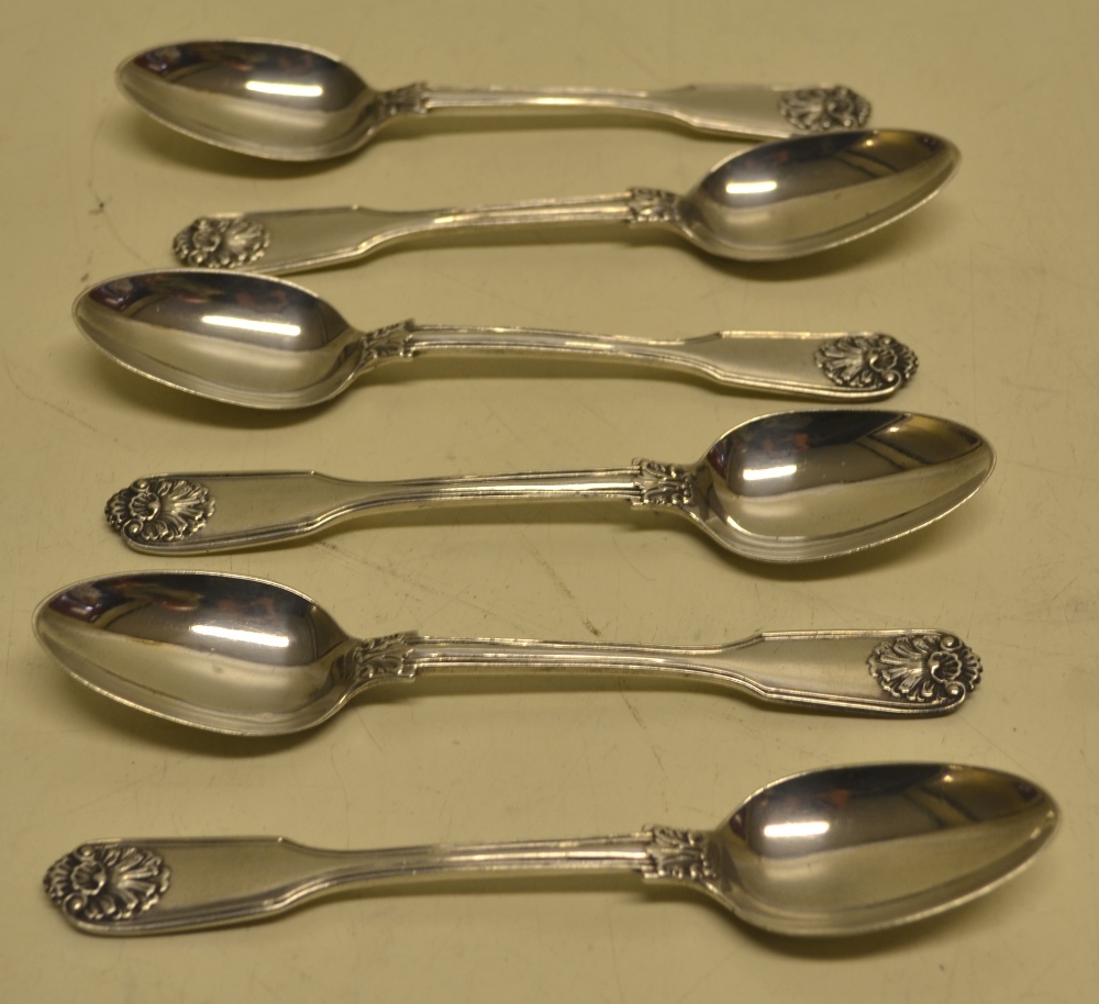 A set of six early Victorian silver teaspoons, Queens husk pattern, engraved a crest above an