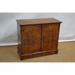 A William and Mary walnut veneered herringbone banded cabinet, the later top on a moulded cornice,