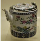 A Chinese canton enamel decorated porcelain teapot, the cylindrical body with two magpies amongst