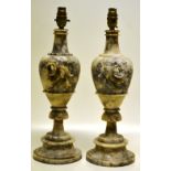 A pair of marble vase shape table lamps, carved roses, fitted for electricity, on circular bases.