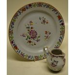 An eighteenth century Chinese porcelain famille rose plate, 9in (23cm) and a baluster cream jug with
