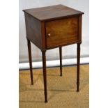 A nineteenth century mahogany bedside cupboard, the reeded edge top above a hinged door on ring