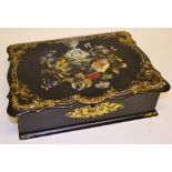 A Victorian black papier mache lap desk, the hinged fold over top flap painted an inlaid a mother of