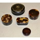 A tortoiseshell nineteenth century circular snuff box with pique inlay. 2.5in (5cm), a late