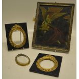A pair of black papier mache miniature frames, with gilt oval apertures. 6in (15cm) x 5in (13cm) A